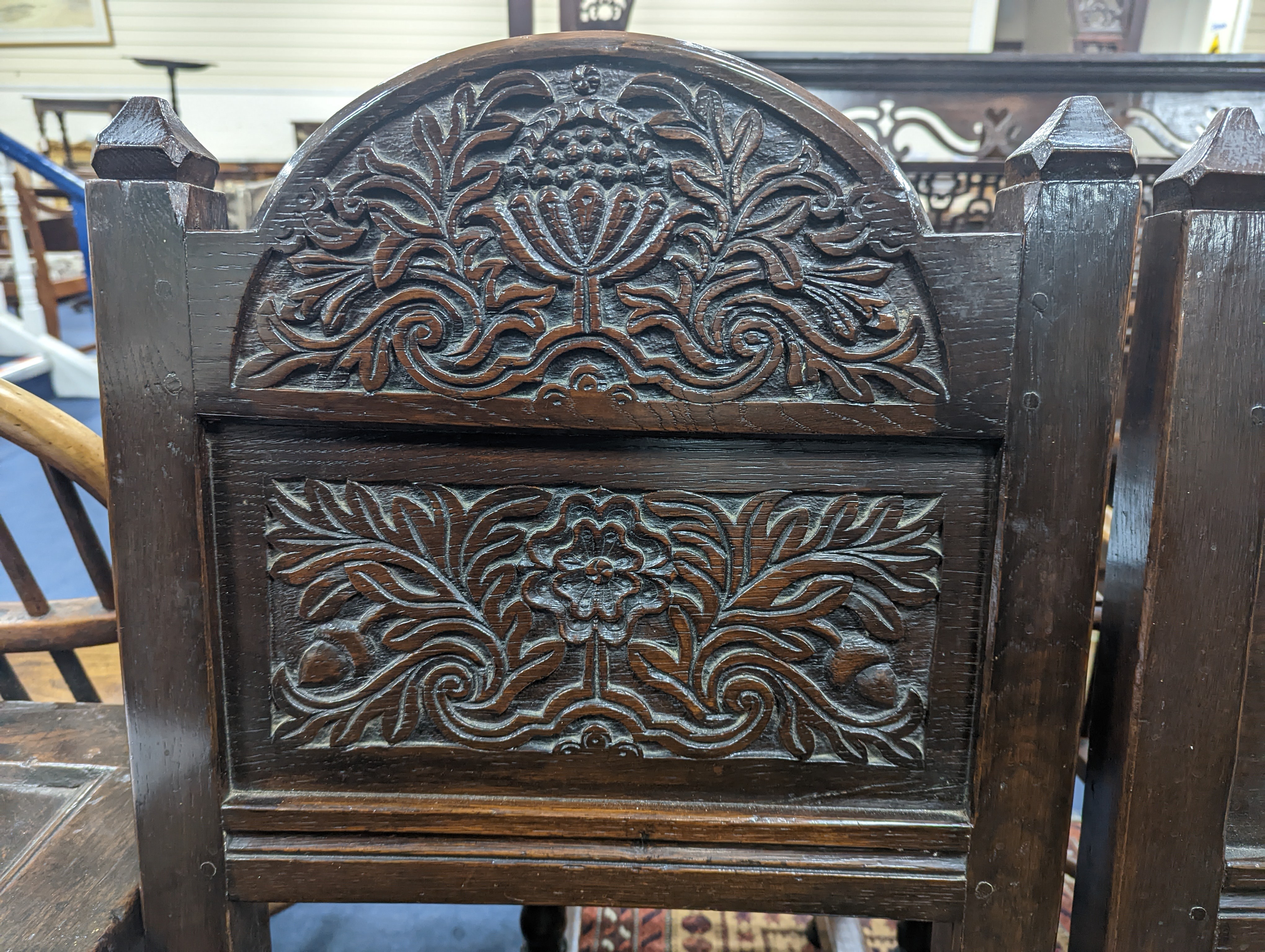 A pair of 17th century Lancashire carved oak side chairs, width 45cm, depth 39cm, height 101cm